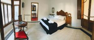 Posada Los Angelos客房内的一张或多张床位