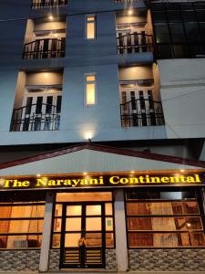 甘托克Hotel The Narayani Continental的带有 ⁇ 子连接标志的建筑
