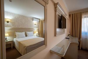 Hotel Orient Galati客房内的一张或多张床位