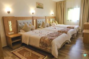 伊尔雅库塔酒店客房内的一张或多张床位