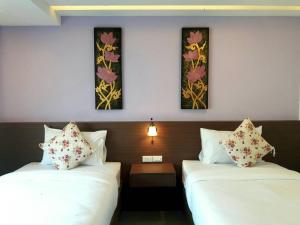 Vista Hotel Chiang Mai - SHA EXTRA PLUS客房内的一张或多张床位