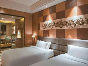 恩施瑞享国际酒店客房内的一张或多张床位