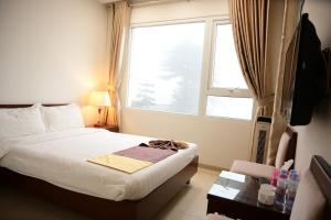 Hà Thành Tam Đảo HOTEL客房内的一张或多张床位