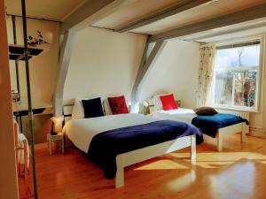 B&B Hart van Leiden客房内的一张或多张床位