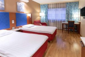斯堪迪克坦佩雷科斯基普斯托酒店客房内的一张或多张床位