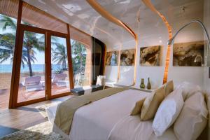 英尼亚拉海滨别墅酒店客房内的一张或多张床位