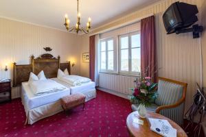 希尔施罗腾堡高登纳酒店客房内的一张或多张床位
