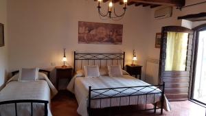Casale sul Lago Trasimeno客房内的一张或多张床位