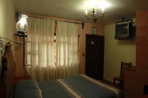 波萨达德拉萨鲁德酒店客房内的一张或多张床位