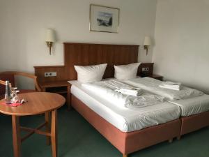 aqualon Hotel Schweizerblick - Therme, Sauna & Wellness客房内的一张或多张床位