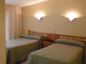 Hotel Agarimo playa Areas客房内的一张或多张床位