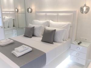 Amaryllis Luxury Rooms客房内的一张或多张床位