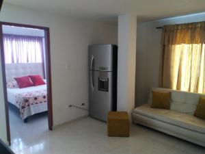 Apartamento oasis del norte客房内的一张或多张床位