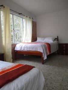 Kaliawiri Bird Lodge & reserve客房内的一张或多张床位