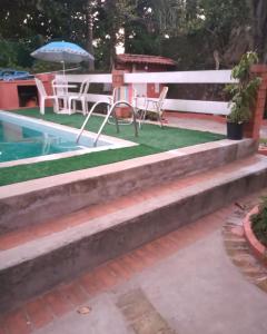 Casa da Roseli - Pitangueiras内部或周边的泳池