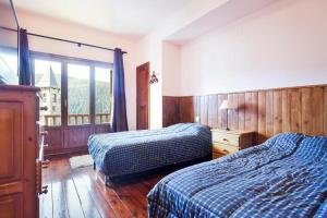 Apartamentos Tanau客房内的一张或多张床位