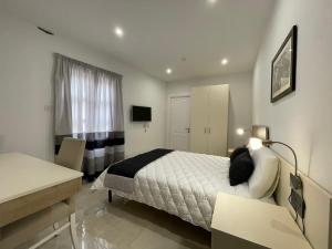 La Reggia Seaview Guesthouse客房内的一张或多张床位