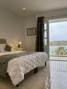 La Reggia Seaview Guesthouse客房内的一张或多张床位