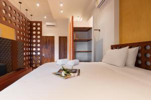 Ganem Suites Cartagena客房内的一张或多张床位