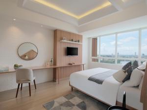 Fika Rooms Tangerang By Skandinavia的电视和/或娱乐中心