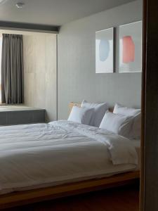 Hotel SANG SANG & Private SANG SANG POOL VILLA客房内的一张或多张床位