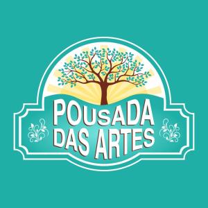 蒙加瓜Pousada das Artes 1的带有普卡迪亚艺术词的树的标志