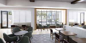 休斯顿Staybridge Suites - Houston NW Cypress Crossings , an IHG Hotel的客厅配有桌椅和沙发