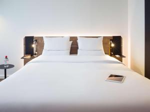 诺富特洛桑布西津酒店 客房内的一张或多张床位