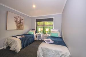 East Jindabyne- Cavallino 4 bedroom home客房内的一张或多张床位