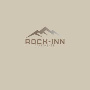 捷克布杰约维采Rock-inn的岩石公寓标志
