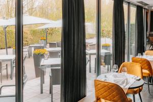 Fletcher Hotel-Restaurant Zevenbergen-Moerdijk餐厅或其他用餐的地方