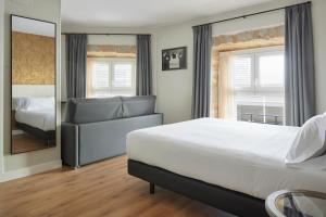 Hotel Arrizul Beach客房内的一张或多张床位