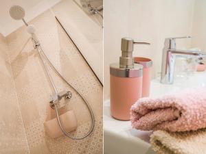 斯普利特Amaris luxury apartments的带淋浴头和盥洗盆的浴室