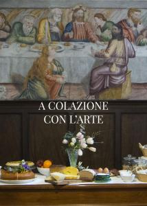 MontefrancoConvento San Bernardino的一张桌子上的一幅画,上面有食物