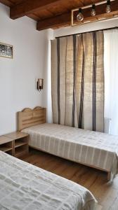 Pensiunea Nádas Panzió客房内的一张或多张床位