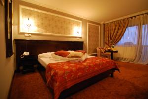 诺比利喀尔巴阡住宅旅馆客房内的一张或多张床位