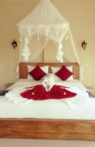 Beras Bali Suite客房内的一张或多张床位