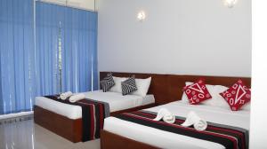 Boo Kirinda Holiday Resort客房内的一张或多张床位