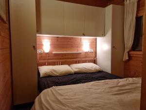 Chalet DIRECT aan Luganomeer客房内的一张或多张床位