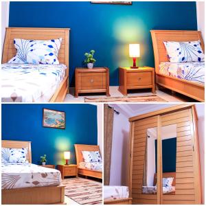胡瓦里耶Villa Island Zembra的卧室两张照片,配有一张床和镜子
