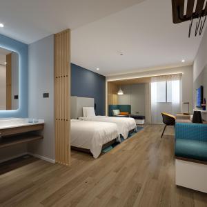 重庆重庆临空智选假日酒店的酒店客房设有床和客厅。