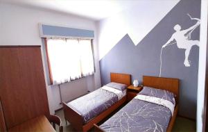 
HOTEL BELLAVISTA Costiera dei Cech Morbegno客房内的一张或多张床位
