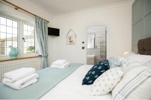 Exclusive Holiday Accommodation - Bancoft Cottage客房内的一张或多张床位
