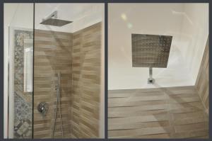 切法卢Villa del Vescovo的带淋浴的浴室和玻璃门