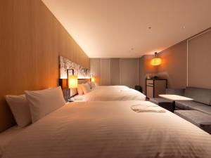 Hotel Forza Kyoto Shijo Kawaramachi客房内的一张或多张床位