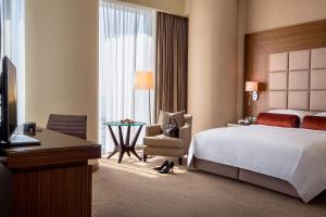 多哈罗塔纳城市中心酒店客房内的一张或多张床位
