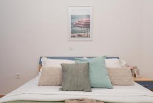 Vila Marina Sea&City View客房内的一张或多张床位