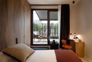 NUMA HOTEL BOUTIQUE客房内的一张或多张床位