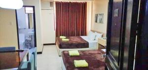 卡利亚拉俱乐部度假酒店客房内的一张或多张床位