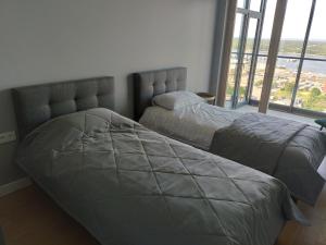 SEA GATE APARTMENT 20th floor客房内的一张或多张床位